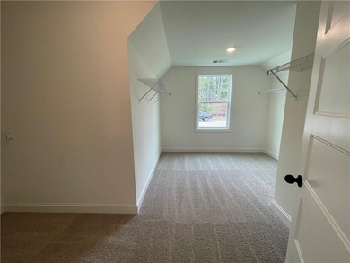 Stunning 2-story home with a 3rd car garage in a coveted on Traditions of Braselton Golf Club in Georgia - for sale on GolfHomes.com, golf home, golf lot