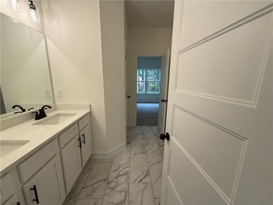 Stunning 2-story home with a 3rd car garage in a coveted on Traditions of Braselton Golf Club in Georgia - for sale on GolfHomes.com, golf home, golf lot