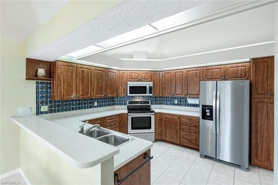 This beautifully maintained 2-bedroom, 2.5-bath condo with a on Wildcat Run Golf and Country Club in Florida - for sale on GolfHomes.com, golf home, golf lot