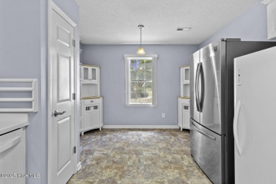 Welcome to this charming 3-bedroom, 2-bathroom home located in on Harbour Point Golf Club in North Carolina - for sale on GolfHomes.com, golf home, golf lot