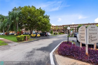 Welcome to this stunning 2-bed 2-bath condo located on the first on Boca Dunes Golf and Country Club in Florida - for sale on GolfHomes.com, golf home, golf lot