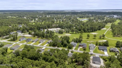 Welcome to this charming 3-bedroom, 2-bathroom home located in on Harbour Point Golf Club in North Carolina - for sale on GolfHomes.com, golf home, golf lot