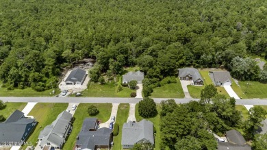 Welcome to this charming 3-bedroom, 2-bathroom home located in on Harbour Point Golf Club in North Carolina - for sale on GolfHomes.com, golf home, golf lot