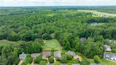 Set against a serene, park-like backdrop with a long view of the on The Tradition Golf Club At Stonehouse in Virginia - for sale on GolfHomes.com, golf home, golf lot