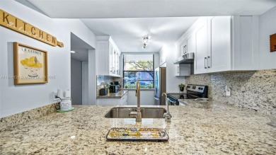 Beautifully updated 2-bed, 2-bath condo in Whitehall at Pine on Pine Island Ridge Country Club in Florida - for sale on GolfHomes.com, golf home, golf lot