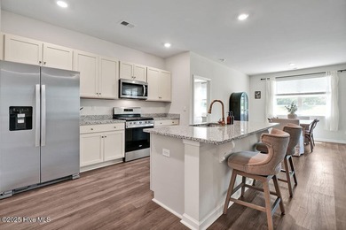 Easy living in this one level home with lawncare included! This on Cape Fear National At Brunswick Forest in North Carolina - for sale on GolfHomes.com, golf home, golf lot