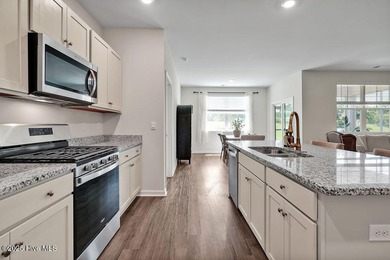 Easy living in this one level home with lawncare included! This on Cape Fear National At Brunswick Forest in North Carolina - for sale on GolfHomes.com, golf home, golf lot