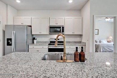 Easy living in this one level home with lawncare included! This on Cape Fear National At Brunswick Forest in North Carolina - for sale on GolfHomes.com, golf home, golf lot