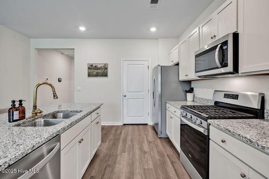 Easy living in this one level home with lawncare included! This on Cape Fear National At Brunswick Forest in North Carolina - for sale on GolfHomes.com, golf home, golf lot