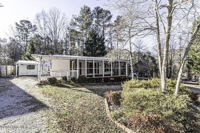 Escape to your own peaceful retreat in the gated community of on River Golf and County Club at Lake Royale in North Carolina - for sale on GolfHomes.com, golf home, golf lot