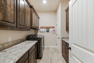 Welcome home to this beautifully designed newer-built property on Legends Country Club in Texas - for sale on GolfHomes.com, golf home, golf lot