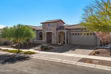 Discover unparalleled luxury in this David Weekley home, located on Verrado Golf Club - Victory in Arizona - for sale on GolfHomes.com, golf home, golf lot