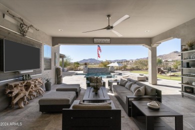 Discover unparalleled luxury in this David Weekley home, located on Verrado Golf Club - Victory in Arizona - for sale on GolfHomes.com, golf home, golf lot