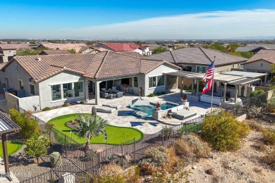 Discover unparalleled luxury in this David Weekley home, located on Verrado Golf Club - Victory in Arizona - for sale on GolfHomes.com, golf home, golf lot