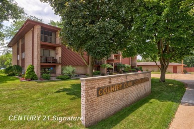 This top floor condo is located next to The Saginaw Country Club on Saginaw Country Club in Michigan - for sale on GolfHomes.com, golf home, golf lot