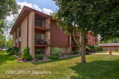 This top floor condo is located next to The Saginaw Country Club on Saginaw Country Club in Michigan - for sale on GolfHomes.com, golf home, golf lot
