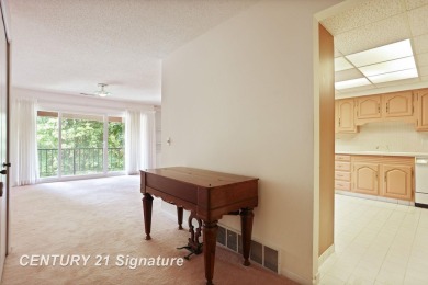 This top floor condo is located next to The Saginaw Country Club on Saginaw Country Club in Michigan - for sale on GolfHomes.com, golf home, golf lot
