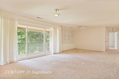 This top floor condo is located next to The Saginaw Country Club on Saginaw Country Club in Michigan - for sale on GolfHomes.com, golf home, golf lot