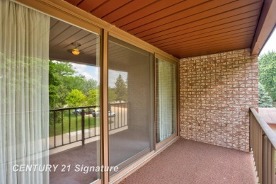 This top floor condo is located next to The Saginaw Country Club on Saginaw Country Club in Michigan - for sale on GolfHomes.com, golf home, golf lot