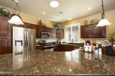 Sit on the north front patio and visit with friendly neighbors on Sunland Springs Golf Course  in Arizona - for sale on GolfHomes.com, golf home, golf lot