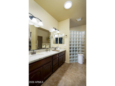 Sit on the north front patio and visit with friendly neighbors on Sunland Springs Golf Course  in Arizona - for sale on GolfHomes.com, golf home, golf lot