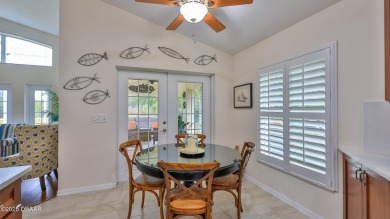 This beautifully updated 3-bedroom 2-bath pool home shows like on Plantation Bay Golf and Country Club in Florida - for sale on GolfHomes.com, golf home, golf lot