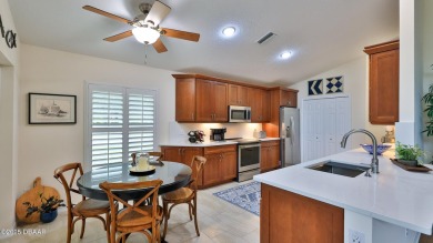This beautifully updated 3-bedroom 2-bath pool home shows like on Plantation Bay Golf and Country Club in Florida - for sale on GolfHomes.com, golf home, golf lot
