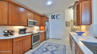 This beautifully updated 3-bedroom 2-bath pool home shows like on Plantation Bay Golf and Country Club in Florida - for sale on GolfHomes.com, golf home, golf lot