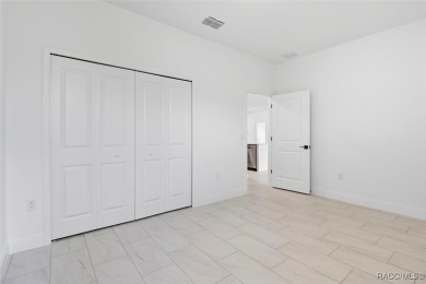 Come fall in love with this beautifully designed NEW on Citrus Springs Country Club in Florida - for sale on GolfHomes.com, golf home, golf lot