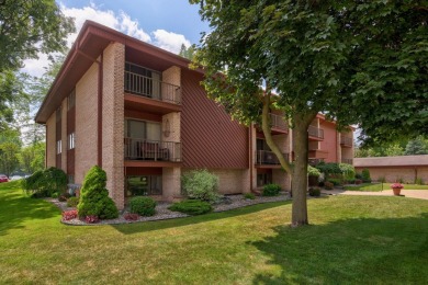 This top floor condo is located next to The Saginaw Country Club on Saginaw Country Club in Michigan - for sale on GolfHomes.com, golf home, golf lot
