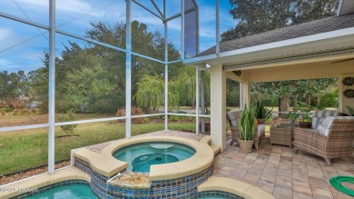 This beautifully updated 3-bedroom 2-bath pool home shows like on Plantation Bay Golf and Country Club in Florida - for sale on GolfHomes.com, golf home, golf lot