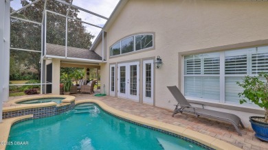 This beautifully updated 3-bedroom 2-bath pool home shows like on Plantation Bay Golf and Country Club in Florida - for sale on GolfHomes.com, golf home, golf lot