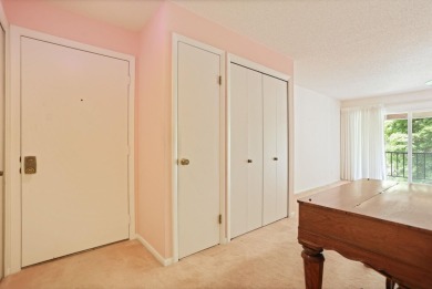 This top floor condo is located next to The Saginaw Country Club on Saginaw Country Club in Michigan - for sale on GolfHomes.com, golf home, golf lot