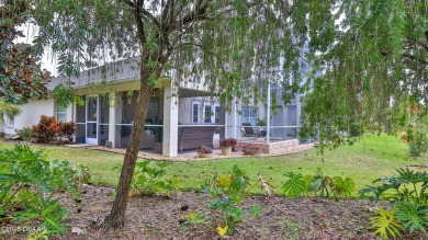 This beautifully updated 3-bedroom 2-bath pool home shows like on Plantation Bay Golf and Country Club in Florida - for sale on GolfHomes.com, golf home, golf lot
