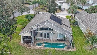 This beautifully updated 3-bedroom 2-bath pool home shows like on Plantation Bay Golf and Country Club in Florida - for sale on GolfHomes.com, golf home, golf lot