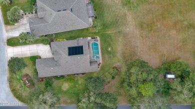 This beautifully updated 3-bedroom 2-bath pool home shows like on Plantation Bay Golf and Country Club in Florida - for sale on GolfHomes.com, golf home, golf lot