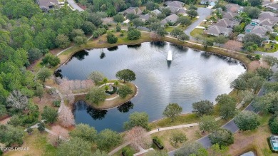 This beautifully updated 3-bedroom 2-bath pool home shows like on Plantation Bay Golf and Country Club in Florida - for sale on GolfHomes.com, golf home, golf lot