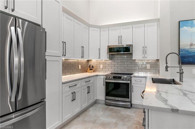 Impeccably Updated Carriage Home with Sweeping Lake Views - on Worthington Country Club in Florida - for sale on GolfHomes.com, golf home, golf lot