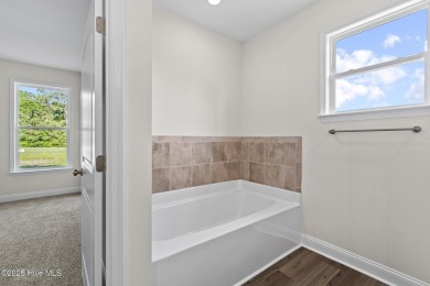 Welcome to ''The Americana'' - a brand-new construction home in on Bear Trail Golf Club in North Carolina - for sale on GolfHomes.com, golf home, golf lot