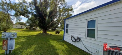 Come settle down and relax in a beautiful manufactured home with on Fairways Country Club in Florida - for sale on GolfHomes.com, golf home, golf lot