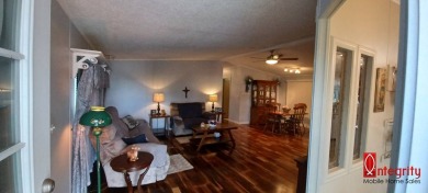 Come settle down and relax in a beautiful manufactured home with on Fairways Country Club in Florida - for sale on GolfHomes.com, golf home, golf lot