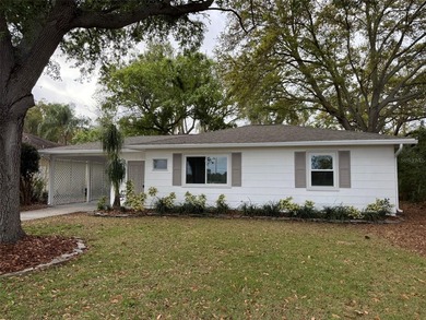 Beautiful, updated 2-bedroom, 1-bath home situated on nearly a on Clearwater Executive Golf Course in Florida - for sale on GolfHomes.com, golf home, golf lot