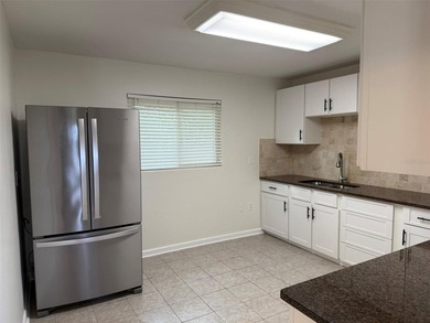 Beautiful, updated 2-bedroom, 1-bath home situated on nearly a on Clearwater Executive Golf Course in Florida - for sale on GolfHomes.com, golf home, golf lot