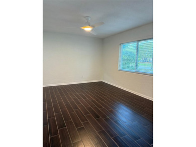 Beautiful, updated 2-bedroom, 1-bath home situated on nearly a on Clearwater Executive Golf Course in Florida - for sale on GolfHomes.com, golf home, golf lot