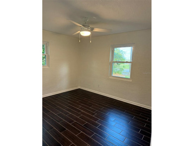 Beautiful, updated 2-bedroom, 1-bath home situated on nearly a on Clearwater Executive Golf Course in Florida - for sale on GolfHomes.com, golf home, golf lot