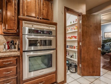 Discover the perfect blend of space, comfort, and location in on Coffee Creek Golf Course in Oklahoma - for sale on GolfHomes.com, golf home, golf lot
