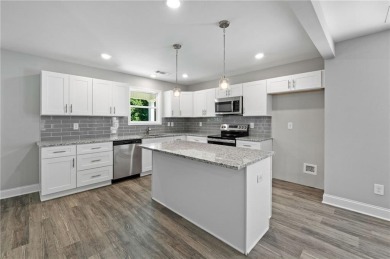 Discover this stunning 3-bedroom, 2.5-bath home with a spacious on Turtle Cove Golf Course in Georgia - for sale on GolfHomes.com, golf home, golf lot