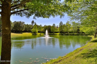 Rarely available one story end unit w/lake and fountain view in on Plantation Bay Golf and Country Club in Florida - for sale on GolfHomes.com, golf home, golf lot