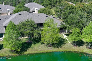 Rarely available one story end unit w/lake and fountain view in on Plantation Bay Golf and Country Club in Florida - for sale on GolfHomes.com, golf home, golf lot