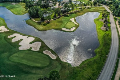 Rarely available one story end unit w/lake and fountain view in on Plantation Bay Golf and Country Club in Florida - for sale on GolfHomes.com, golf home, golf lot